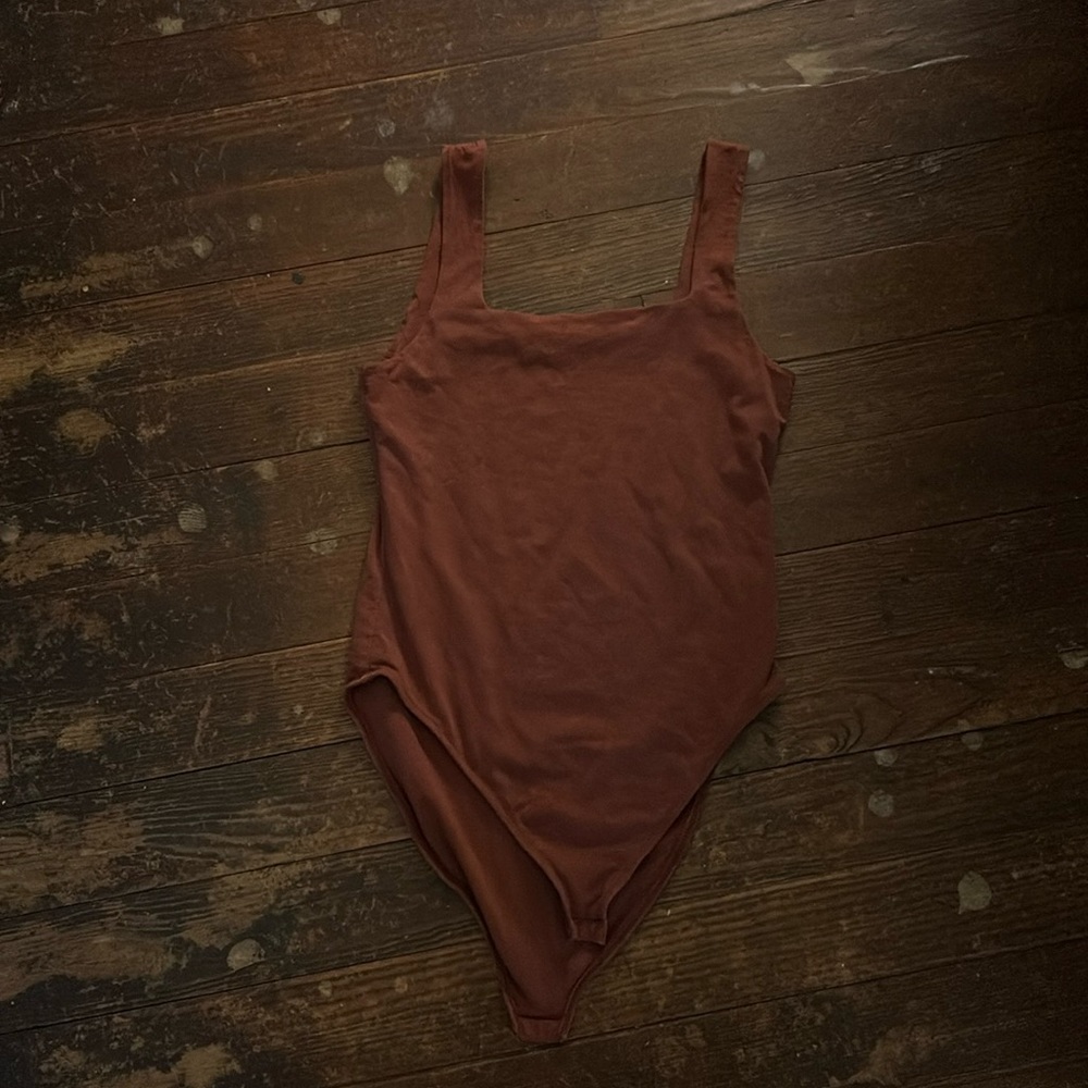 Two bodysuits as a pair the shirt is a brown in Size small
